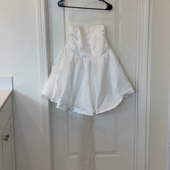 Showpo. Cailene Mini Dress with Bow train and Pearls, 12 - Picture 1 of 6